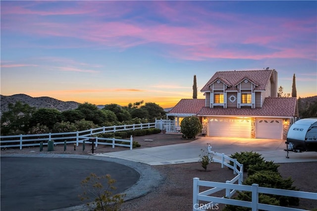33693 Cattle Creek Rd, Acton, CA 93510 - view of front facade featuring a tiled roof, driveway, an attached garage, and stone siding