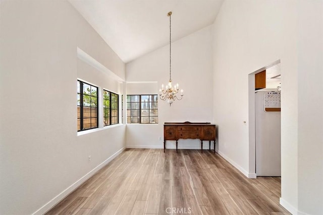 6517 Via Del Prado, Chino Hills, CA 91709 - dining area featuring high vaulted ceiling, wood finished floors, a chandelier, and baseboards
