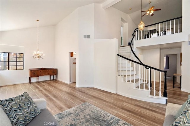 6517 Via Del Prado, Chino Hills, CA 91709 - living room with high vaulted ceiling, wood finished floors, a chandelier, baseboards, and stairway