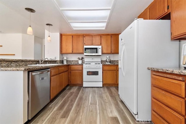 6517 Via Del Prado, Chino Hills, CA 91709 - kitchen with white appliances, a sink, brown cabinetry, and light wood-style flooring