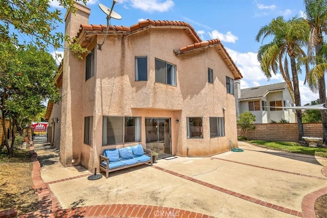 6517 Via Del Prado, Chino Hills, CA 91709 - rear view of house featuring stucco siding, a patio, and a chimney