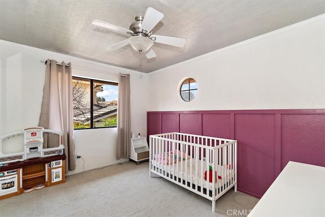 6517 Via Del Prado, Chino Hills, CA 91709 - bedroom with carpet flooring, a crib, a ceiling fan, crown molding, and wainscoting