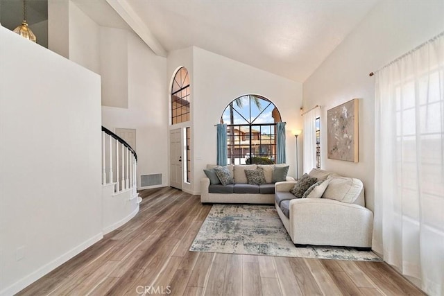 6517 Via Del Prado, Chino Hills, CA 91709 - living area with high vaulted ceiling, wood finished floors, stairs, and baseboards