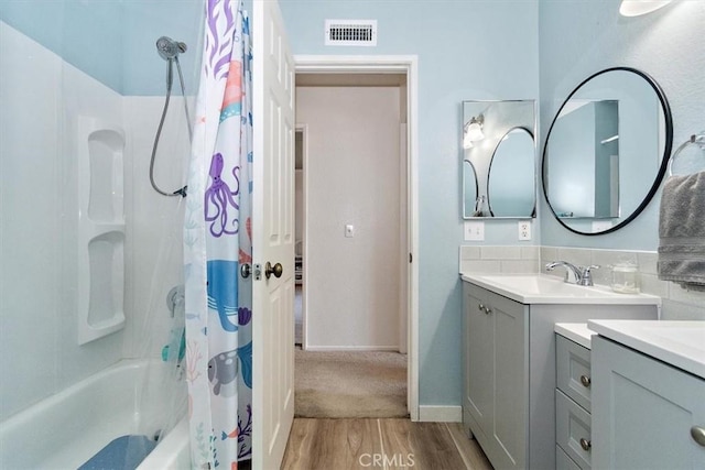 6517 Via Del Prado, Chino Hills, CA 91709 - full bathroom featuring vanity, wood finished floors, shower / tub combo, and baseboards