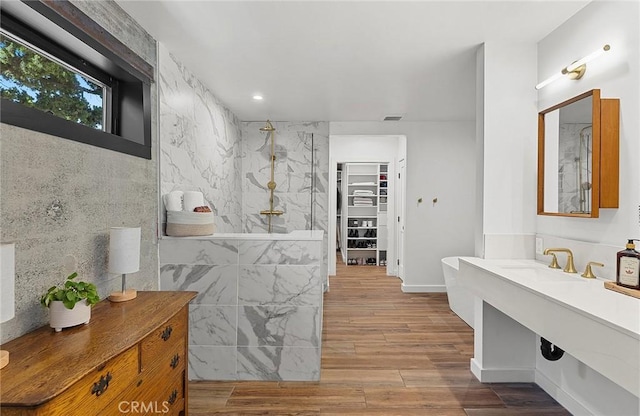 31303 Andres Pico Rd, San Juan Capistrano, CA 92675 - hallway featuring wood finished floors, a sink, and recessed lighting