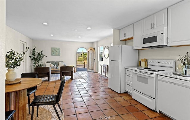 31303 Andres Pico Rd, San Juan Capistrano, CA 92675 - kitchen with white appliances, white cabinets, tile patterned flooring, light countertops, and recessed lighting