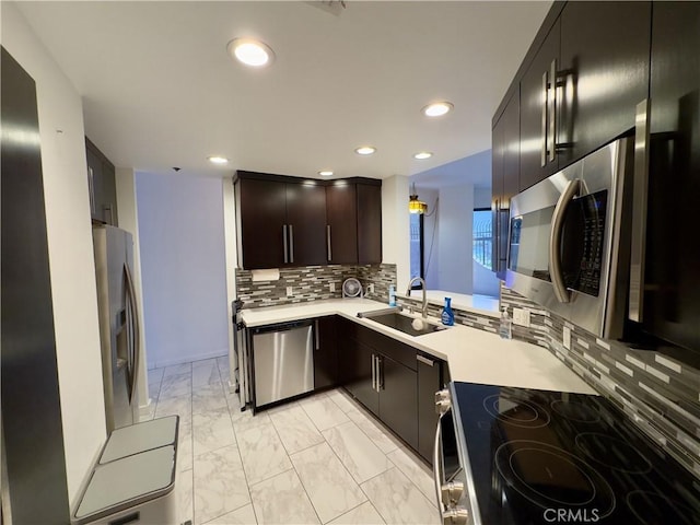 1310 E Ocean Blvd Unit 101, Long Beach, CA 90802 - kitchen with appliances with stainless steel finishes, light countertops, a sink, light marble finish floors, and recessed lighting