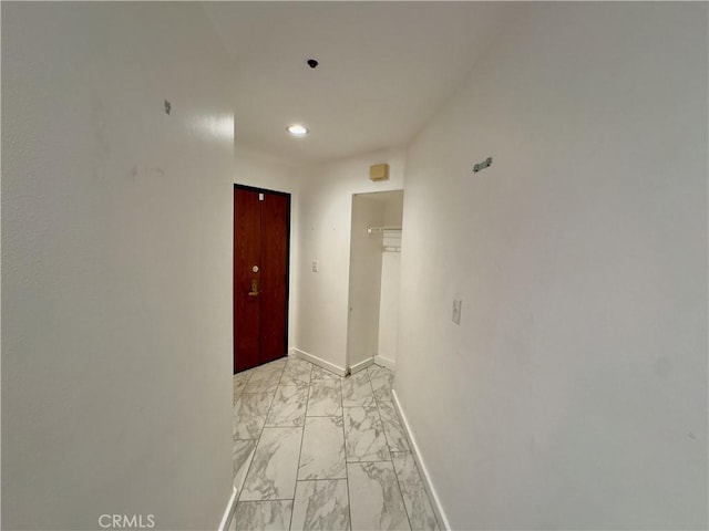 1310 E Ocean Blvd Unit 101, Long Beach, CA 90802 - corridor featuring light marble finish flooring, recessed lighting, and baseboards