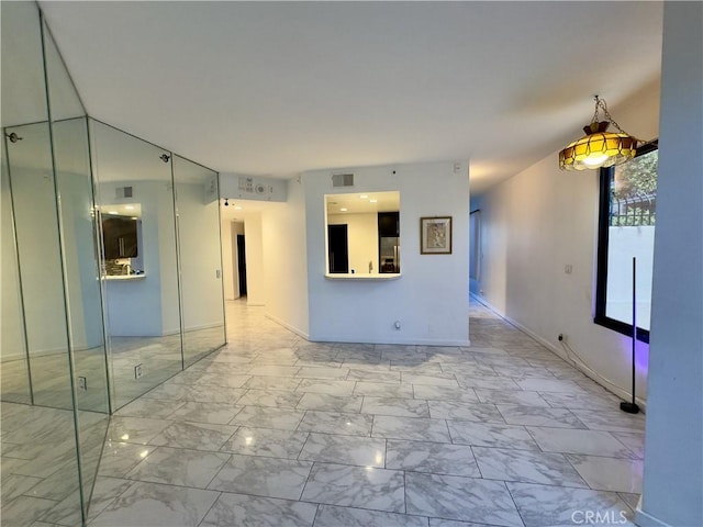 1310 E Ocean Blvd Unit 101, Long Beach, CA 90802 - unfurnished room featuring light marble finish flooring and baseboards