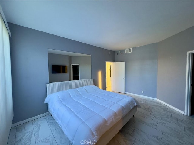 1310 E Ocean Blvd Unit 101, Long Beach, CA 90802 - bedroom with marble finish floors and baseboards