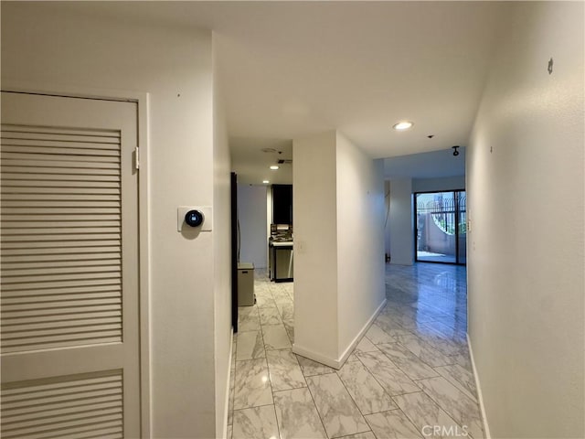 1310 E Ocean Blvd Unit 101, Long Beach, CA 90802 - corridor featuring light marble finish flooring and baseboards