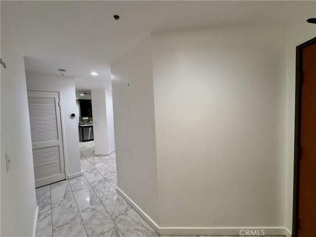 1310 E Ocean Blvd Unit 101, Long Beach, CA 90802 - hallway featuring light marble finish floors, baseboards, and recessed lighting