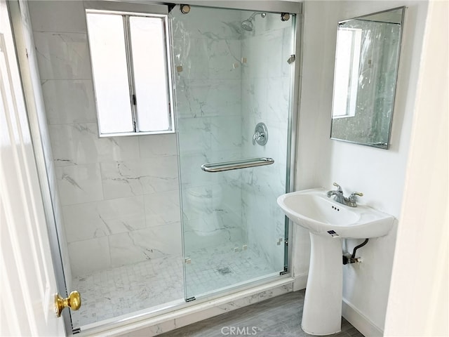 1330 S Reservoir St, Pomona, CA 91766 - bathroom featuring a marble finish shower, plenty of natural light, and baseboards
