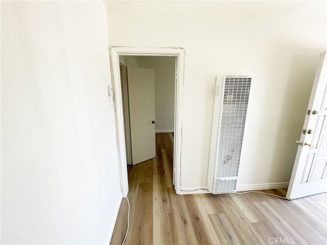 1330 S Reservoir St, Pomona, CA 91766 - hall with a heating unit, light wood-type flooring, and baseboards