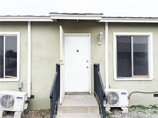 1330 S Reservoir St, Pomona, CA 91766 - entrance to property featuring stucco siding and ac unit