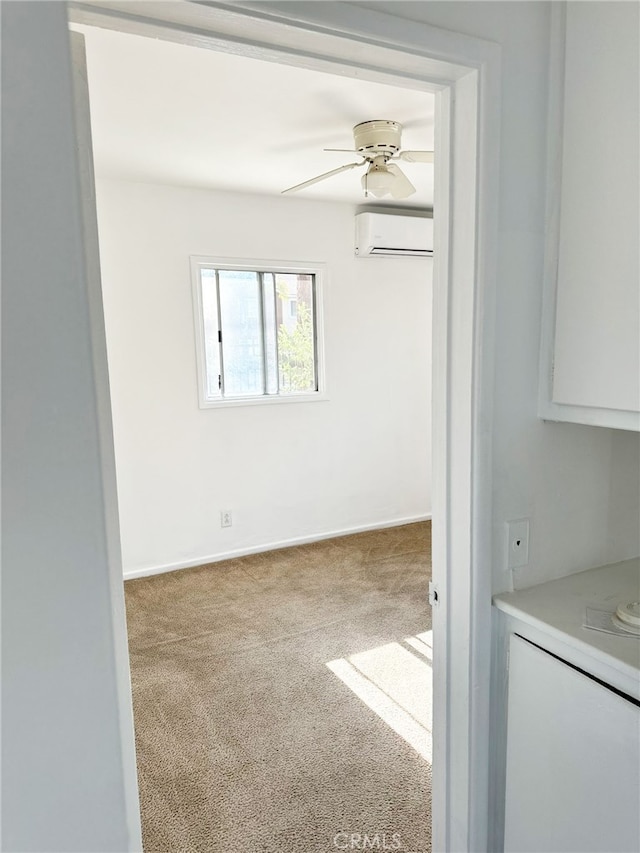 1330 S Reservoir St, Pomona, CA 91766 - carpeted spare room featuring a wall unit AC, a ceiling fan, and baseboards