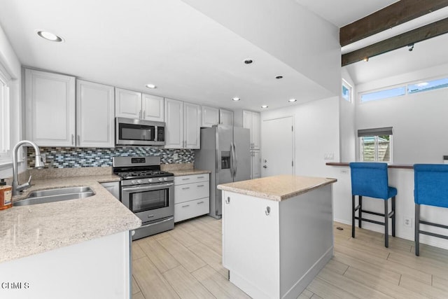 1805 Adelaide Ct, Oxnard, CA 93035 - kitchen with stainless steel appliances, a sink, decorative backsplash, wood tiled floors, and recessed lighting