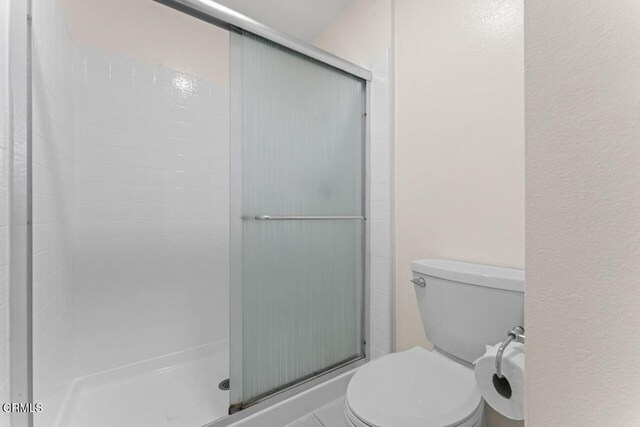 1805 Adelaide Ct, Oxnard, CA 93035 - full bathroom featuring a stall shower and toilet