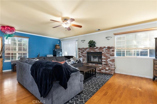 4524 Mananita Ave, Atascadero, CA 93422 - living room with ceiling fan, baseboards, wood finished floors, a brick fireplace, and ornamental molding
