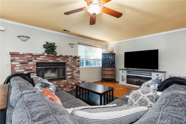 4524 Mananita Ave, Atascadero, CA 93422 - living area featuring a fireplace, crown molding, wood finished floors, a ceiling fan, and baseboards