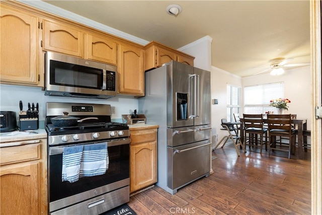 4524 Mananita Ave, Atascadero, CA 93422 - kitchen with stainless steel appliances, light countertops, dark wood-type flooring, a ceiling fan, and ornamental molding