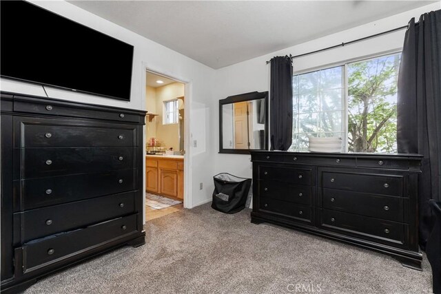 4524 Mananita Ave, Atascadero, CA 93422 - bedroom featuring light colored carpet, multiple windows, ensuite bathroom, and baseboards
