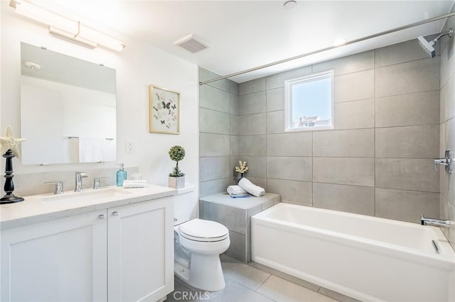 bathroom featuring tile patterned floors, toilet, and vanity