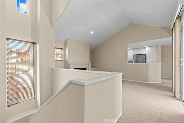 1 Firenze Ct, Newport Coast, CA 92657 - corridor with lofted ceiling, light carpet, an upstairs landing, and baseboards
