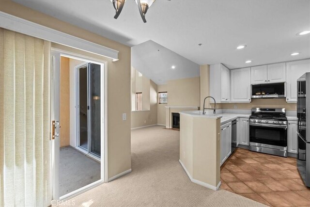 1 Firenze Ct, Newport Coast, CA 92657 - kitchen featuring appliances with stainless steel finishes, a peninsula, light countertops, recessed lighting, and white cabinets