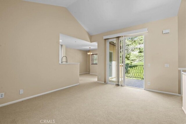 1 Firenze Ct, Newport Coast, CA 92657 - carpeted spare room featuring a chandelier, vaulted ceiling, plenty of natural light, and baseboards