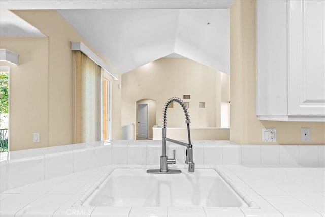 1 Firenze Ct, Newport Coast, CA 92657 - kitchen view of a sink, arched walkways, tile countertops, and white cabinetry