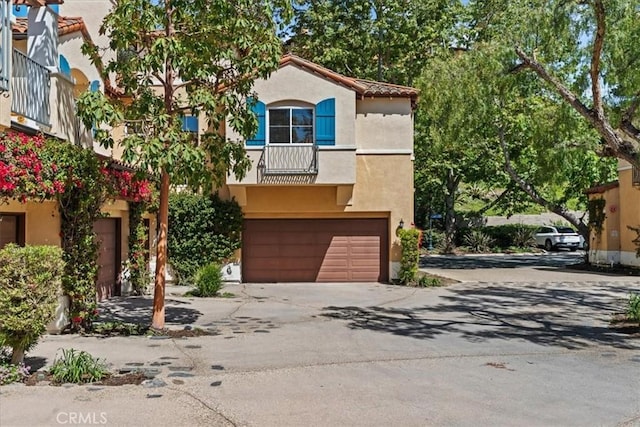 1 Firenze Ct, Newport Coast, CA 92657 - mediterranean / spanish home featuring stucco siding, a garage, driveway, and a tile roof