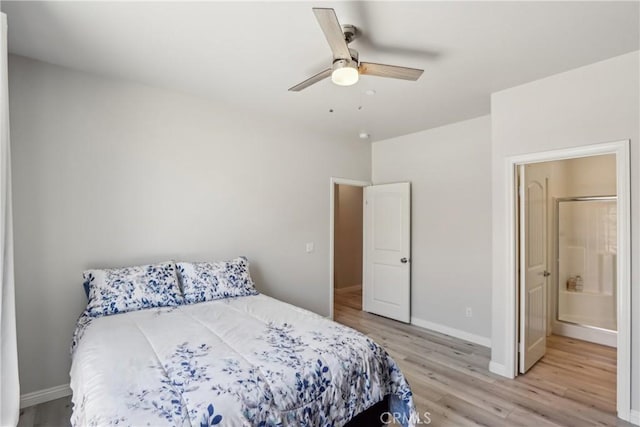 29167 Moraga St, Menifee, CA 92584 - bedroom with light wood-style flooring, baseboards, a ceiling fan, and ensuite bathroom