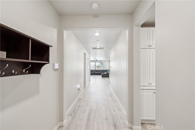 29167 Moraga St, Menifee, CA 92584 - corridor with light wood-style flooring and baseboards
