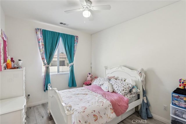 29167 Moraga St, Menifee, CA 92584 - bedroom featuring light wood-style floors, baseboards, and ceiling fan