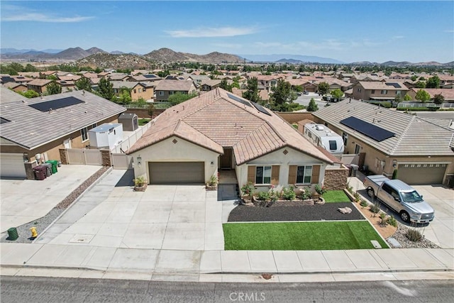29167 Moraga St, Menifee, CA 92584 - ranch-style house featuring a residential view, a garage, a tiled roof, driveway, and a mountain view