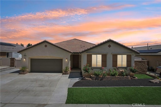 29167 Moraga St, Menifee, CA 92584 - mediterranean / spanish-style home featuring stucco siding, a garage, concrete driveway, and a tile roof