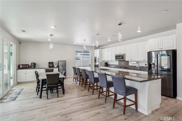 29167 Moraga St, Menifee, CA 92584 - kitchen with appliances with stainless steel finishes, a sink, light wood-style flooring, plenty of natural light, and recessed lighting