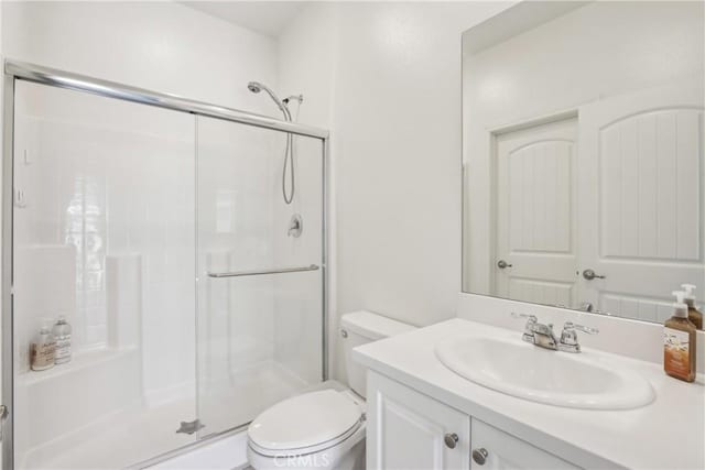 29167 Moraga St, Menifee, CA 92584 - full bath featuring a stall shower, toilet, and vanity