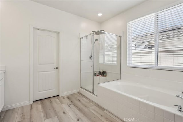 29167 Moraga St, Menifee, CA 92584 - bathroom featuring a garden tub, healthy amount of natural light, and a shower stall