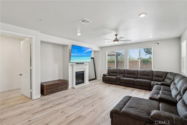 29167 Moraga St, Menifee, CA 92584 - living room featuring a ceiling fan, a fireplace, light wood-style floors, recessed lighting, and baseboards