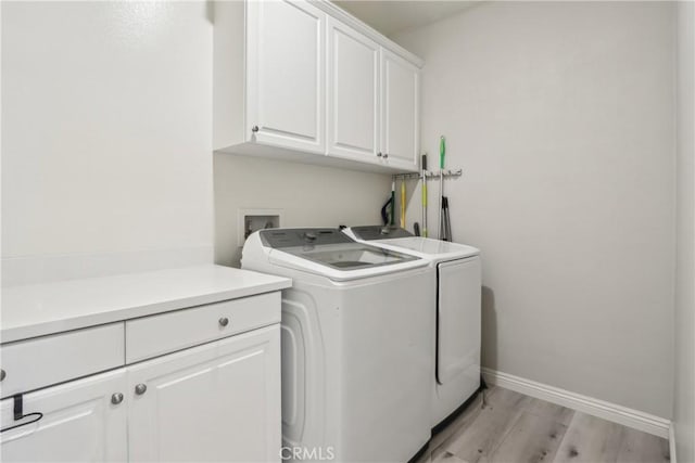 29167 Moraga St, Menifee, CA 92584 - laundry room with cabinet space, independent washer and dryer, baseboards, and light wood-style floors