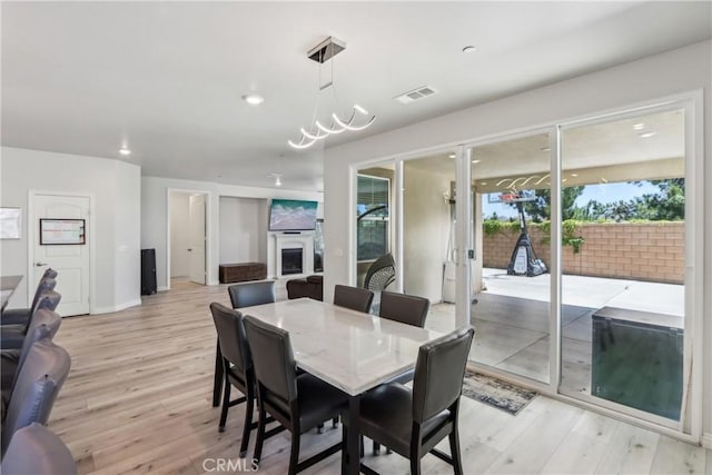 29167 Moraga St, Menifee, CA 92584 - dining space with healthy amount of natural light, light wood finished floors, baseboards, and recessed lighting
