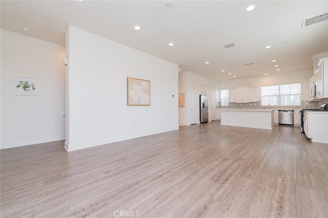 15926 Ellington Way, Chino Hills, CA 91709 - unfurnished living room with light wood-type flooring and recessed lighting