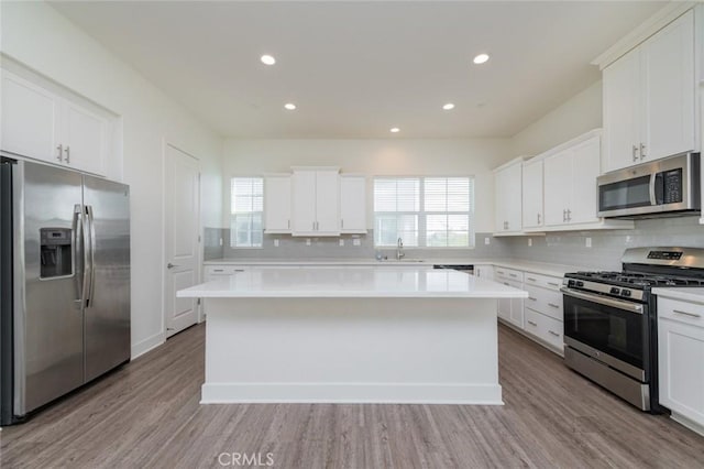 15926 Ellington Way, Chino Hills, CA 91709 - kitchen with appliances with stainless steel finishes, a sink, backsplash, light countertops, and recessed lighting