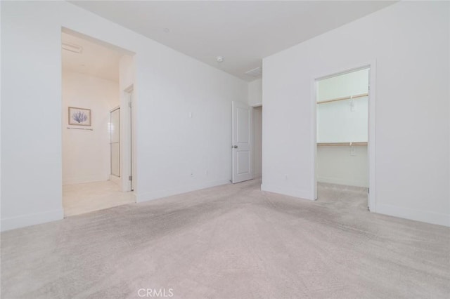 15926 Ellington Way, Chino Hills, CA 91709 - unfurnished bedroom featuring carpet, a walk in closet, a closet, and connected bathroom