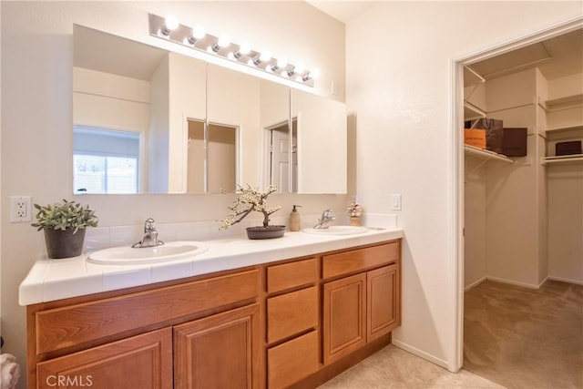 28046 Crystal Spring Dr, Menifee, CA 92584 - bathroom featuring double vanity and a walk in closet
