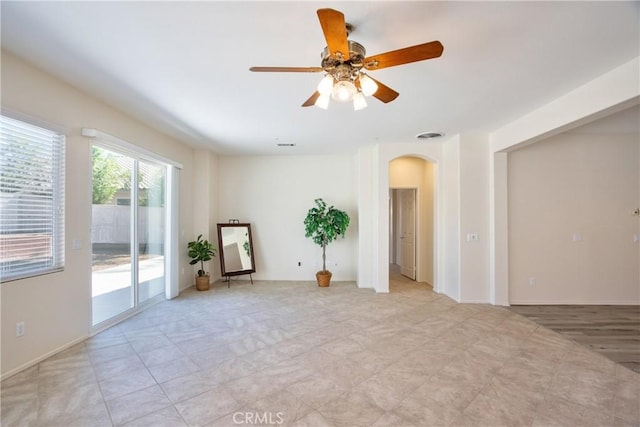 28046 Crystal Spring Dr, Menifee, CA 92584 - empty room with arched walkways and a ceiling fan