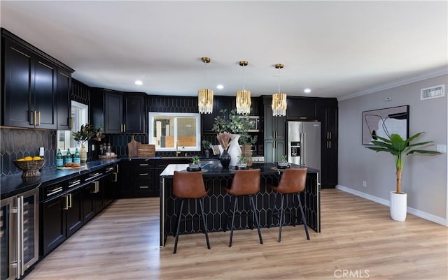 4325 N Country Club Ln, Long Beach, CA 90807 - kitchen featuring beverage cooler, high end refrigerator, a kitchen bar, dark countertops, and recessed lighting