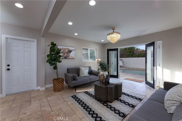4325 N Country Club Ln, Long Beach, CA 90807 - living room with stone tile floors, baseboards, a chandelier, and recessed lighting